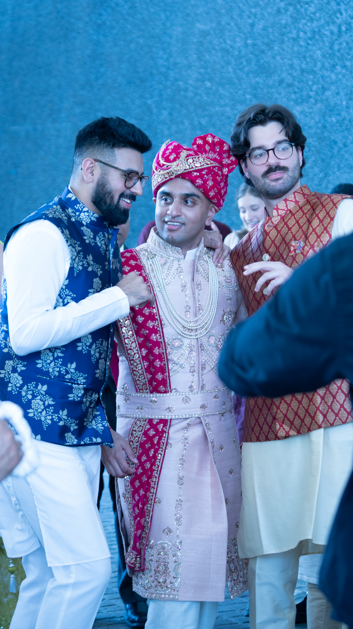 Indian groom with friends at wedding.