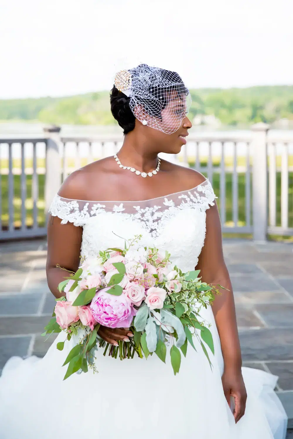 Black bride with bouquet.